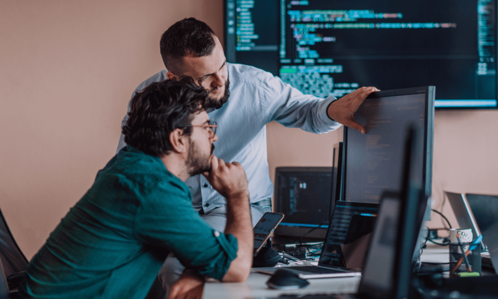 A person instructing another person on coding
